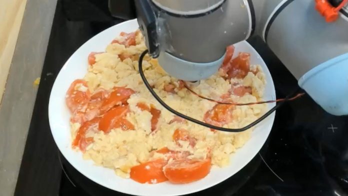 photo issued by the University of Cambridge of a robot tasting eggs and tomato. A robot "chef" has been trained to taste food at different stages of the chewing process to check if it is salty enough, imitating a similar process in humans. Issue date: Wednesday May 4, 2022.